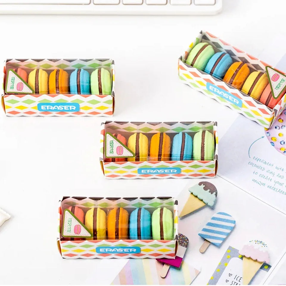un lot de gommes en forme de macarons gourmands colorés : bleu, rose, vert, jaune, orange avec un coeur chocolat. Effet trompe l'oeil réaliste et mignon.