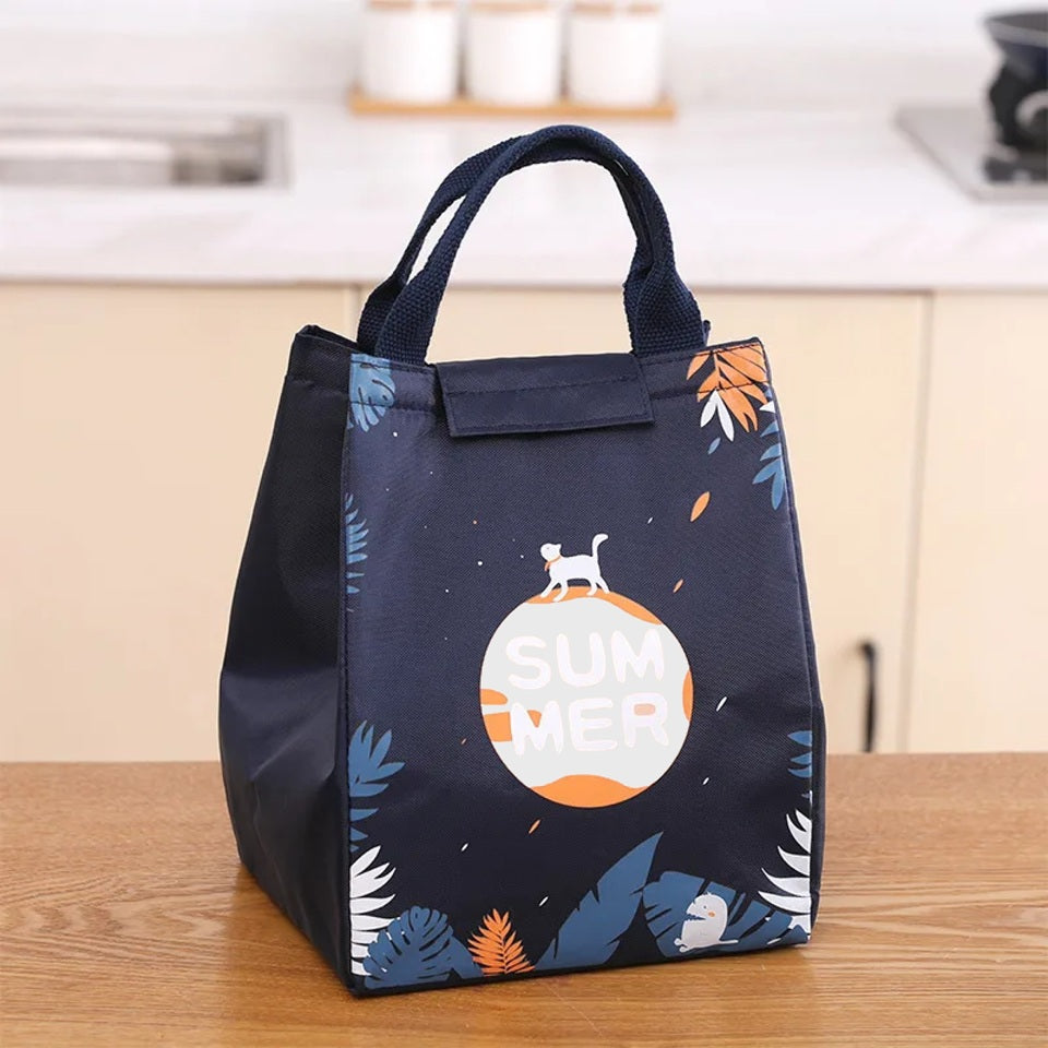 un lunch bag isotherme au design de feuilles et d'un chat. Idéal pour transporter vos repas, boisons et snacks.