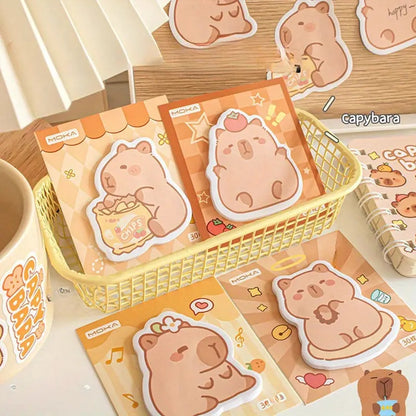 des mémos adhésifs inspirés des capybara. Avec leur expression calme et tendre, ils sont adorables. Dans des positions amusantes et mignonnes, ils sont parfaits pour laisser des messages.