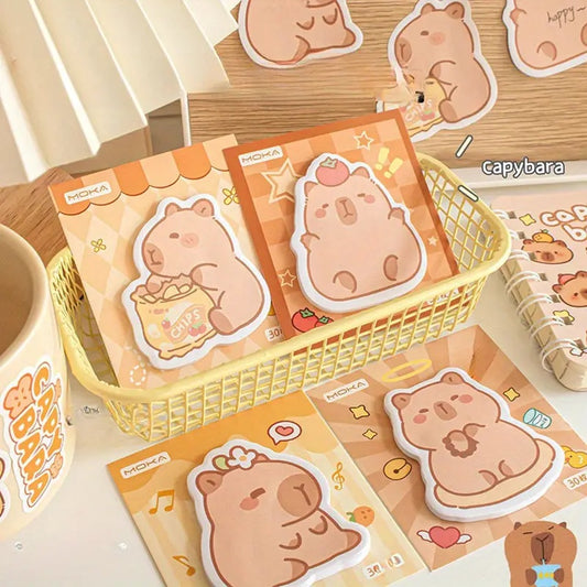 des mémos adhésifs inspirés des capybara. Avec leur expression calme et tendre, ils sont adorables. Dans des positions amusantes et mignonnes, ils sont parfaits pour laisser des messages.