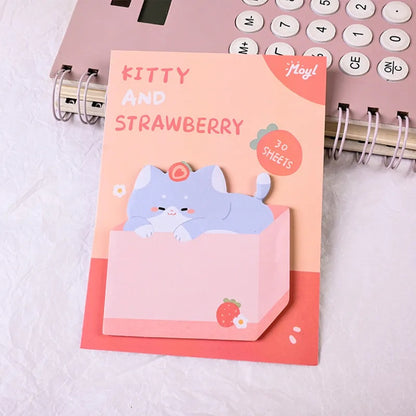 Mémo adhésif chat kawaii version cerise, chat brun et blanc dans son carton rouge 🍒