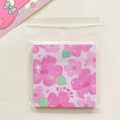 un mémo adhésif représentant de jolies fleurs de sakura roses. Idéal pour laisser des petits mots, des notes avec une touche florale et mignonne.