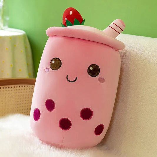 une peluche en forme de bubble tea rose hyper gourmand à l'expression kawaiii trop choupi