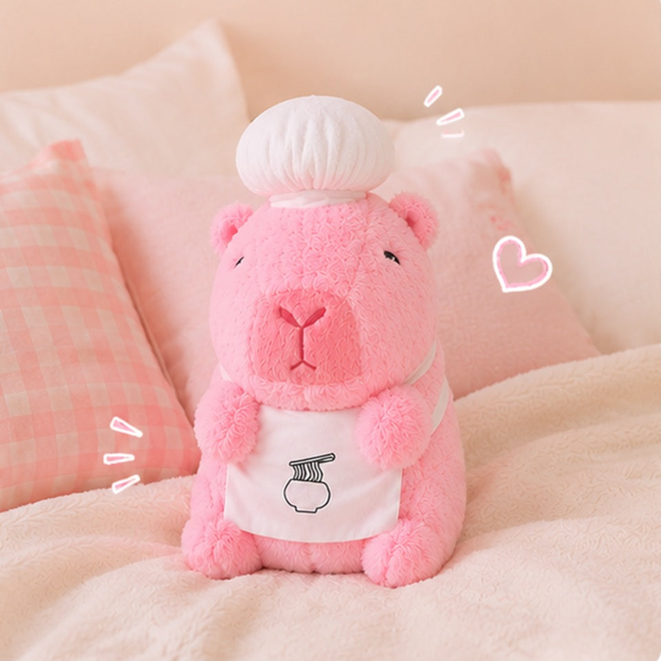 Peluche capybara rose kawaii avec toque de chef et tablier, ultra moelleuse, ambiance cocooning 🦫