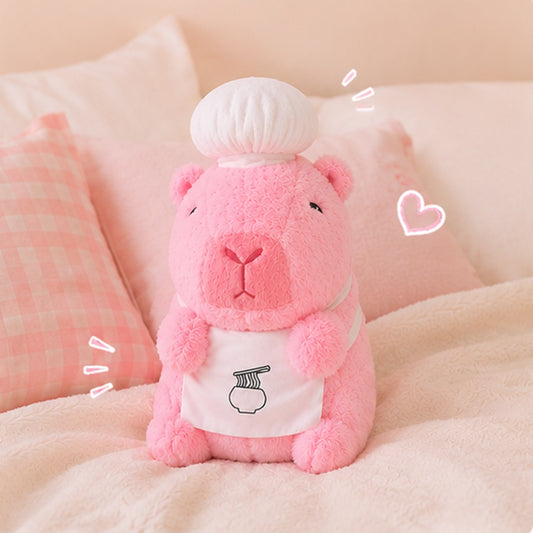 Peluche capybara rose kawaii avec toque de chef et tablier, ultra moelleuse, ambiance cocooning 🦫