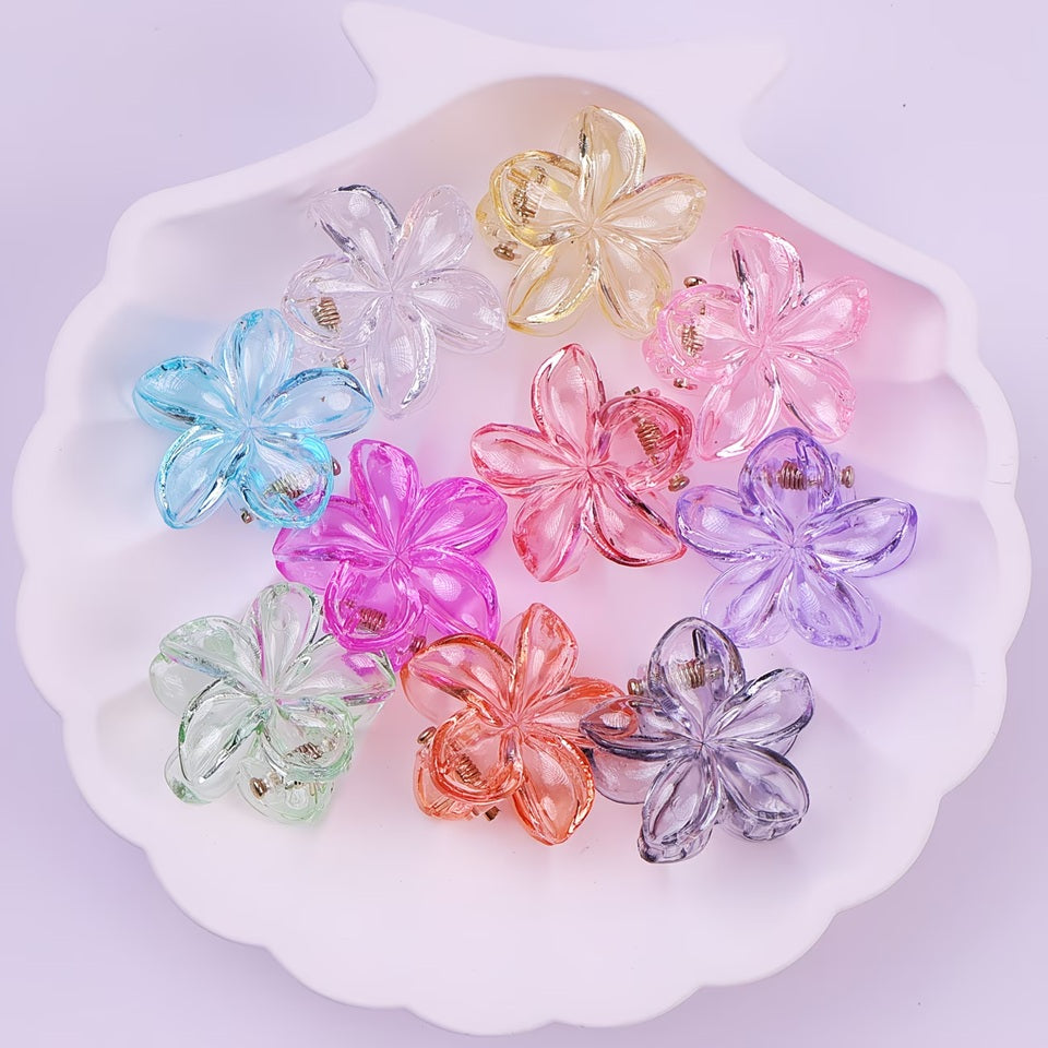 de jolies pinces à cheveux en forme de fleurs colorées transparentes. Elles habillent avec élégance et mignonnerie n'importe quelle coiffure. Look printanier et romantique garanti.