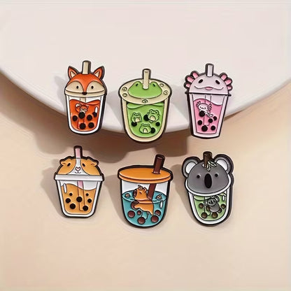 de jolis pin's en forme de bubble tea coloré et 'animaux qui pataugent dans le bubble tea. Le couvercle des pin's représente chaque animal. Ils sont trop mignons !