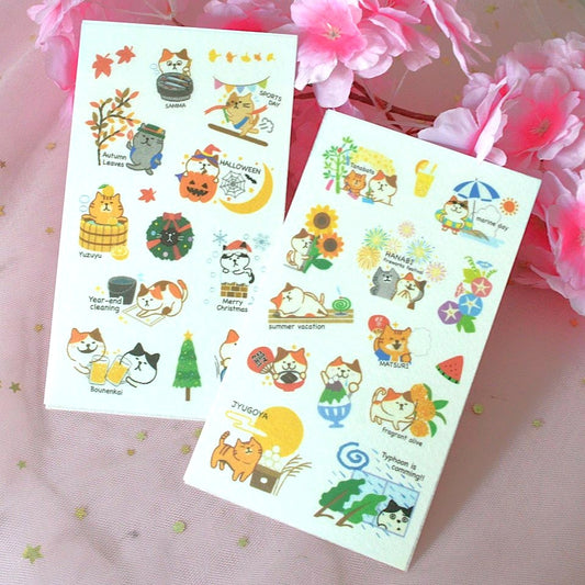 des planches de stickers représentant des chats de toutes les couleurs dans des scènes de la vie et des traditions japonaises : hanami, feux d'artifice, koi nobori etc...
