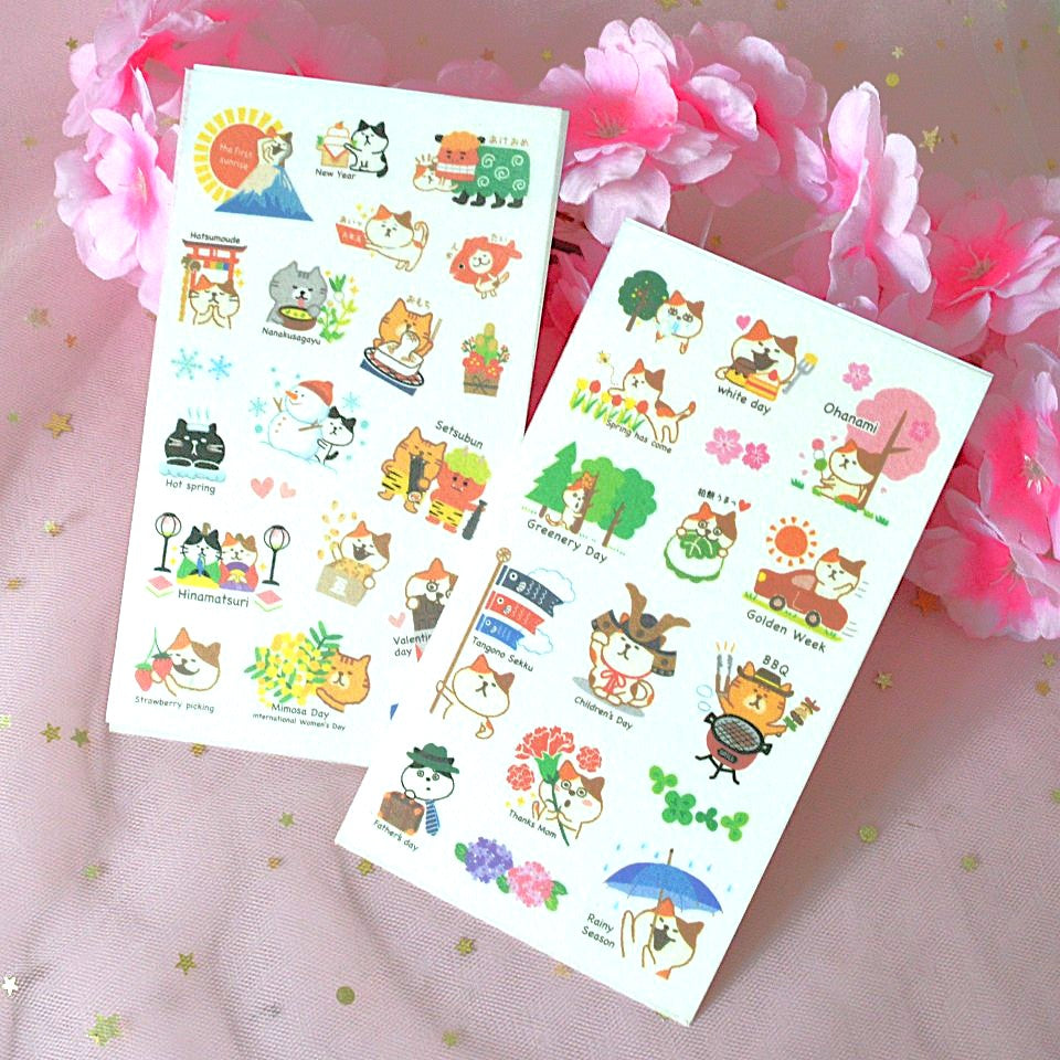 des planches de stickers représentant des chats de toutes les couleurs dans des scènes de la vie et des traditions japonaises : hanami, feux d'artifice, koi nobori etc...