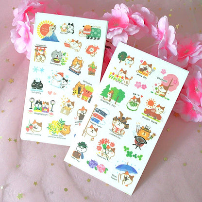 des planches de stickers représentant des chats de toutes les couleurs dans des scènes de la vie et des traditions japonaises : hanami, feux d'artifice, koi nobori etc...