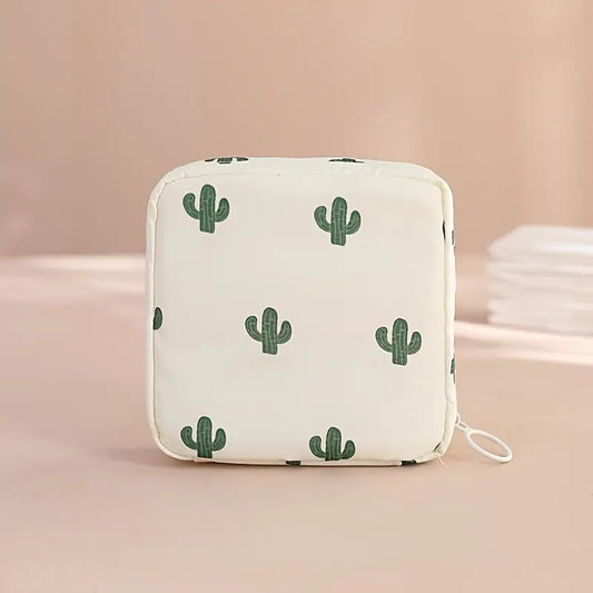 une pochette de rangement zippée au motif de cactus pour transporter en toute discrétion protections hygiéniques. Peut également servir pour y ranger maquillage et petits accessoires.