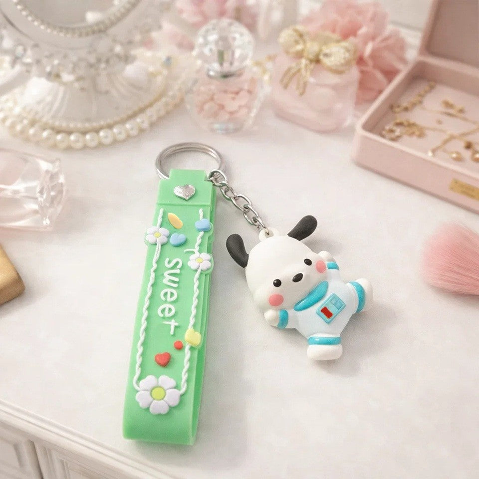 un adorable porte-clé représentant Pochacco dans un habit d'astronaute ! Ensemble mignon !