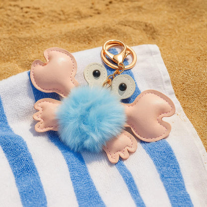 porte-clé en forme de crabe, tout fluffy et doux. En simili cuir, il est solide et durable. Idéal pour un trousseau ou en déco de sac