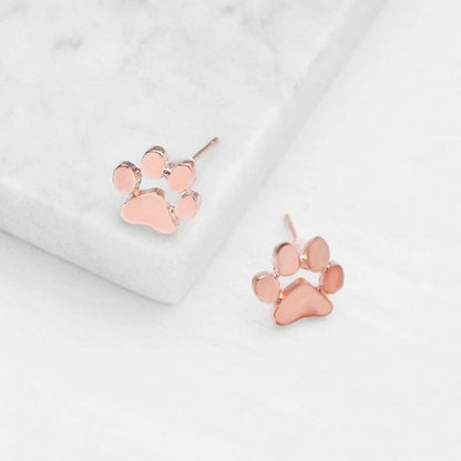 une paire de boucles d'oreilles en forme de pattes d'animaux en coloris rose gold