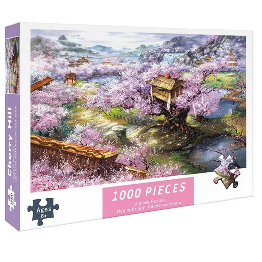 un puzzle de 1000 pièces représentant un paysage japonais : au loin des montagnes mystérieuses, une vallée remplie de sakura en fleurs dans un petit village aux toits typiques, pagodes et rivière.