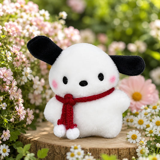 un adorable porte-clé tout en peluche et en douceur en forme d'un chien blanc aux longues oreilles noires qui porte une écharpe rouge.