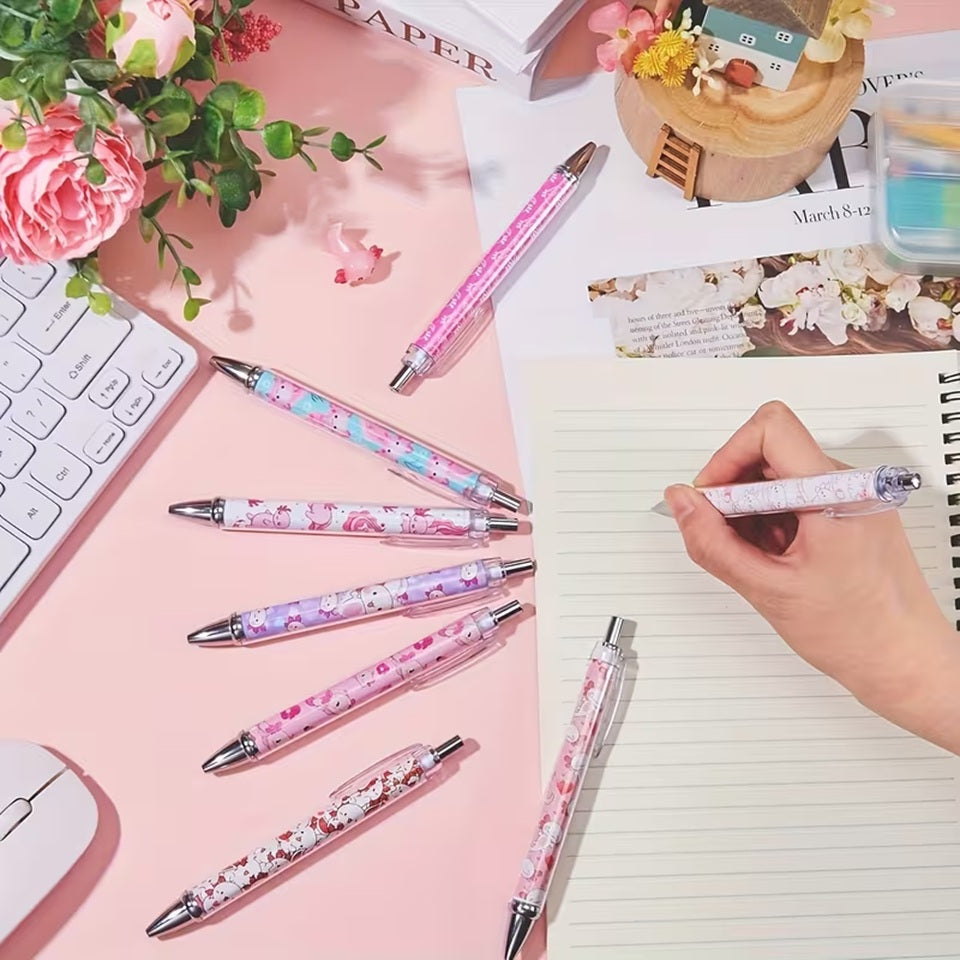 des stylos colorés dans les tons roses mauves blancs illustrés d'axolotl trop mignons !