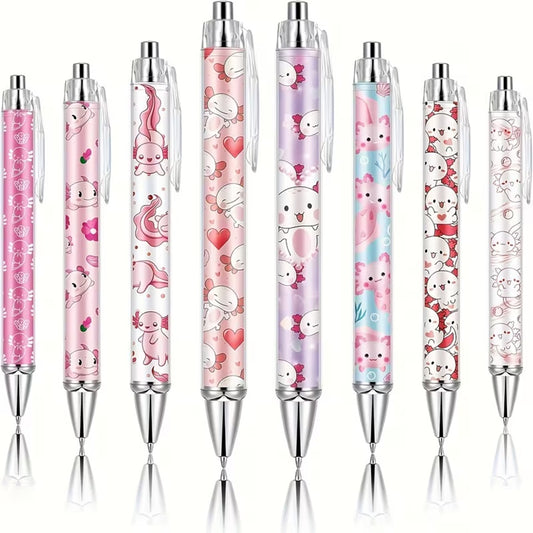 des stylos colorés dans les tons roses mauves blancs illustrés d'axolotl trop mignons !