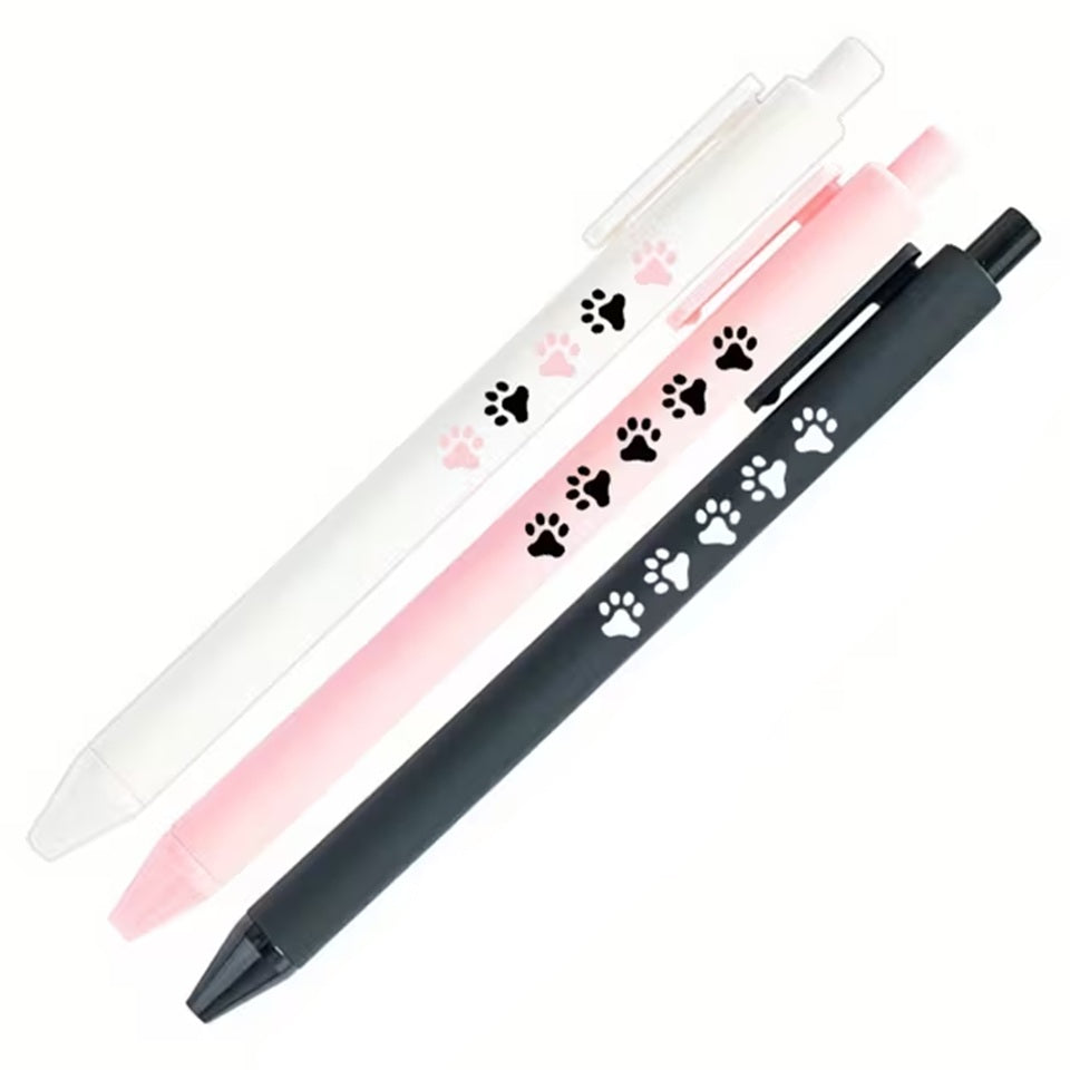 Un stylo blanc, noir ou rose parsemé de petites empreintes de pattes d'animaux toutes mignonnes