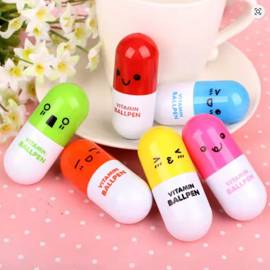 des stylos en forme de gélule colorée avec des expressions kawaii amusantes et fun