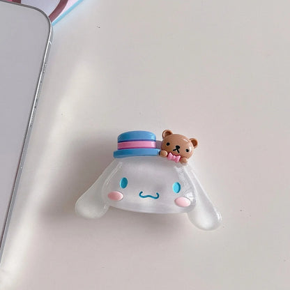 un joli support grip phosphorescent en forme de cinnamoroll ! Accessoire mignon, utile et pratique !