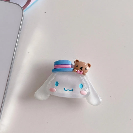 un joli support grip phosphorescent en forme de cinnamoroll ! Accessoire mignon, utile et pratique !