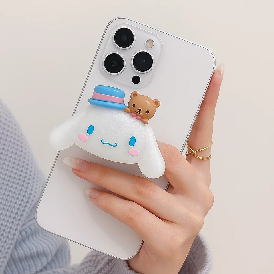 un joli support grip phosphorescent en forme de cinnamoroll ! Accessoire mignon, utile et pratique !