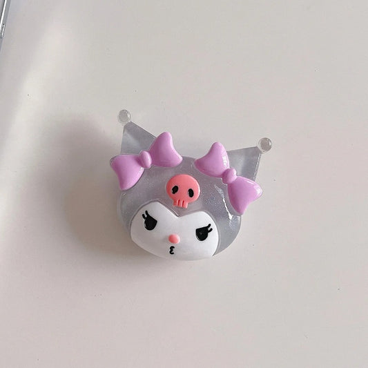 un support grip phosphorescent pour smartphone en forme de l'espiègle Kuromi ! 