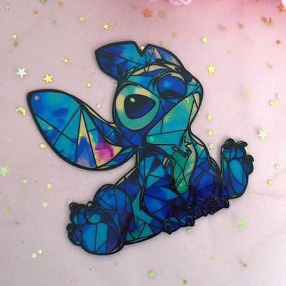 une décoration à suspendre en forme de stich tout coloré façon mosaïque