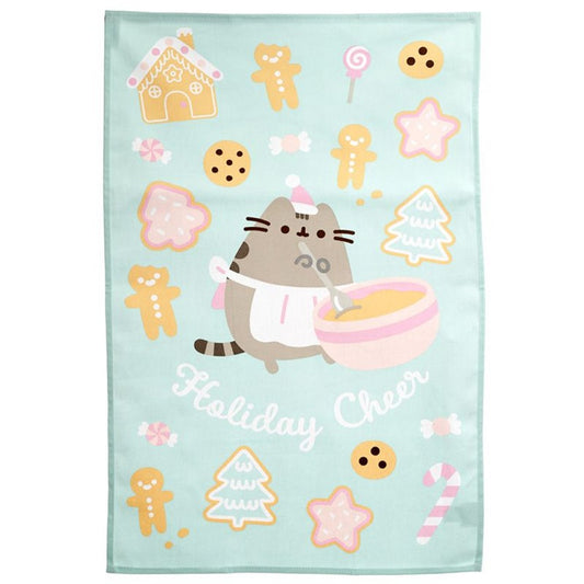 un torchon en coton au motif de Pusheen hyper mignon et coloré. Sur le thème de Noël, il y a des cookies, des sapins, des bonhommes en pain d'épices typiques de la saison hivernale.