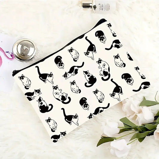 une trousse de toilette au motif de chats blancs et noirs dans des positions différentes amusantes et mignonnes.